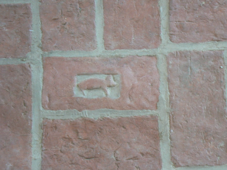 Brick flooring with animal stamp