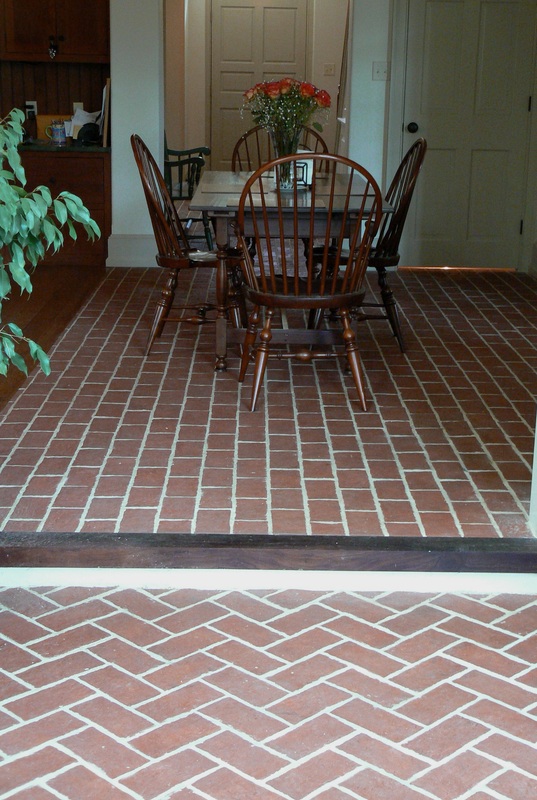 Picture brick tile floor with step