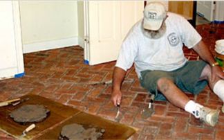 Installing and grouting brick tile floors