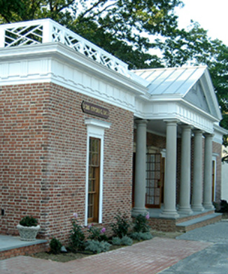 Cement block building covered with brick tiles inspired by Monticello