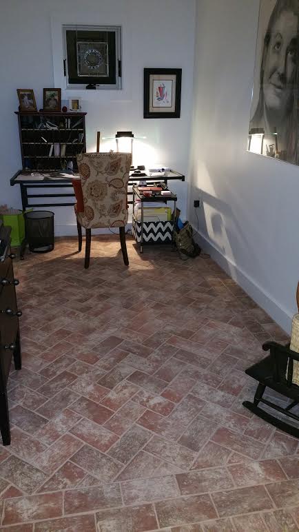 Whitewashed brick floor tile in home office